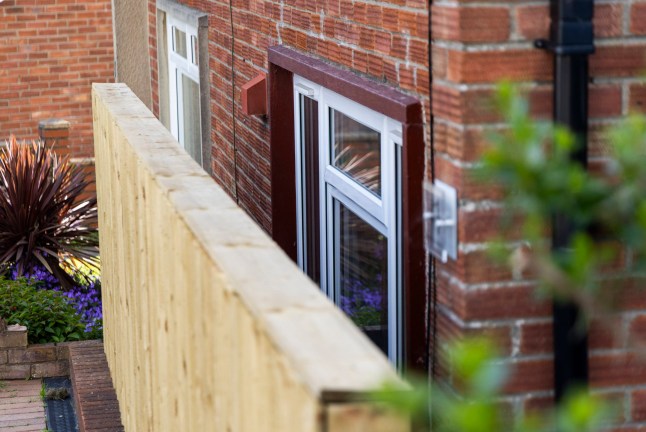 Neighbours have been left baffled after a council installed a huge garden fence across a living room window. Large wooden panels have completely obscured the view from inside after being placed just centimetres away from the house. The home in Bristol is currently unoccupied but council staff were seen carrying out work at the property this week.. Bristol. 12 May 2026. Photo released 13/05/2026