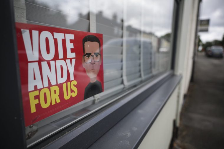 WIGAN, ENGLAND - MAY 21: An election leaflet reading "Vote Andy For Us" is seen on a window in Hindley on May 21, 2026 in Wigan, England. The Makerfield by-election will take place on Thursday 18 June 2026 after Labour MP Josh Simons resigned to make way for Greater Manchester Mayor Andy Burnham to run giving him a route back to Westminster. While Labour won this seat at the 2024 general election with 45.2% of the vote to Reform UK's 31.8%, recent local council elections in May 2026 saw a shift, with Reform UK winning 49.8% of the area's vote compared to Labour's 24.3%. (Photo by Ryan Jenkinson/Getty Images)