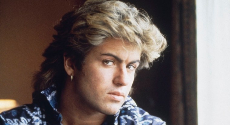 English singer-songwriter George Michael (1963-2016) of Wham!, posed in a hotel room in Sydney, Australia during the pop duo's 1985 world tour in January 1985. 'The Big Tour' took in the UK, Japan, Australia, China and the US. (Photo by Michael Putland/Getty Images)