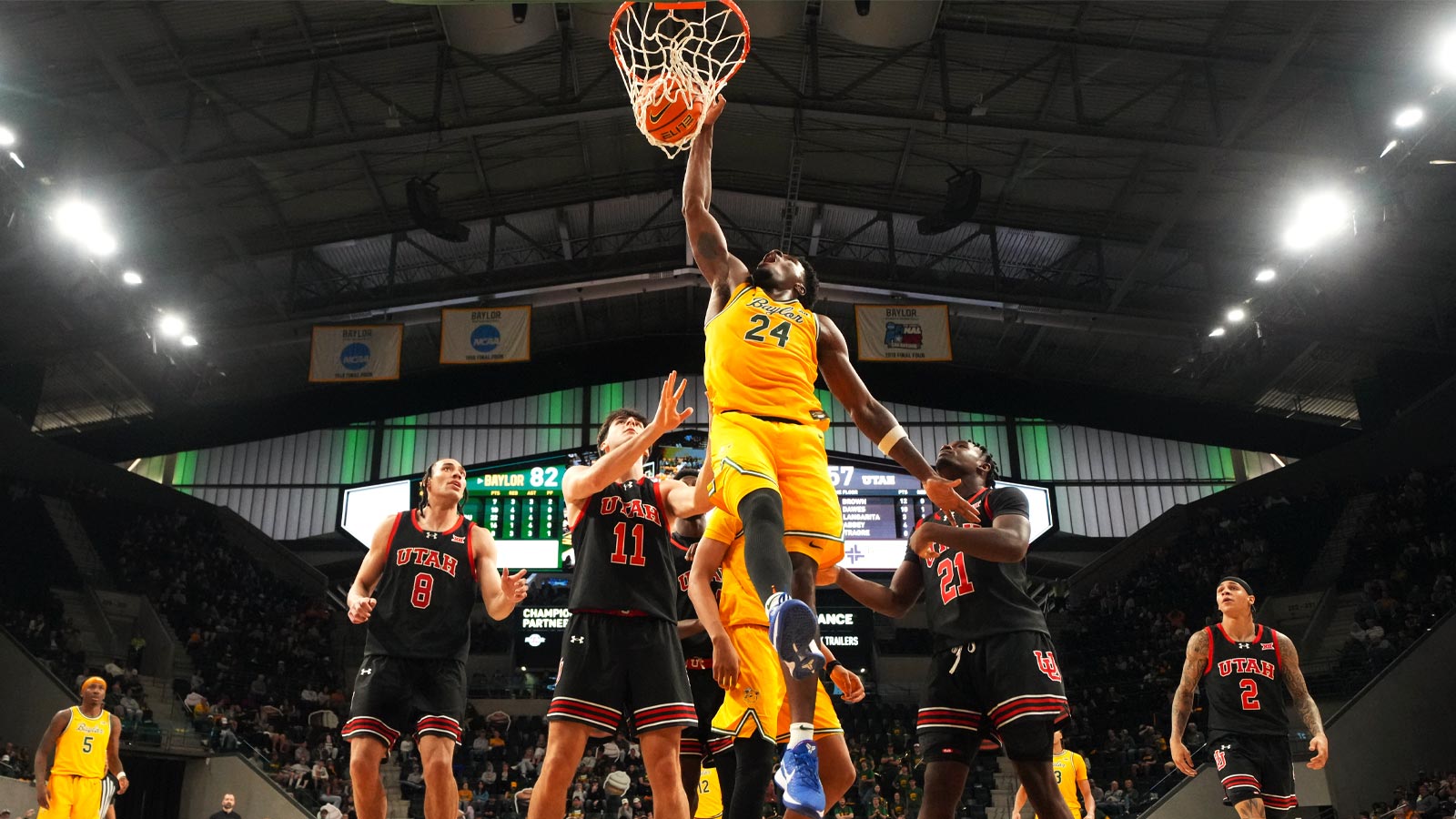 Baylor Bears guard Tounde Yessoufou (24) dunks the ball ahead of Utah Utes guard Obomate Abbey (21) during the second half at Paul and Alejandra Foster Pavilion.