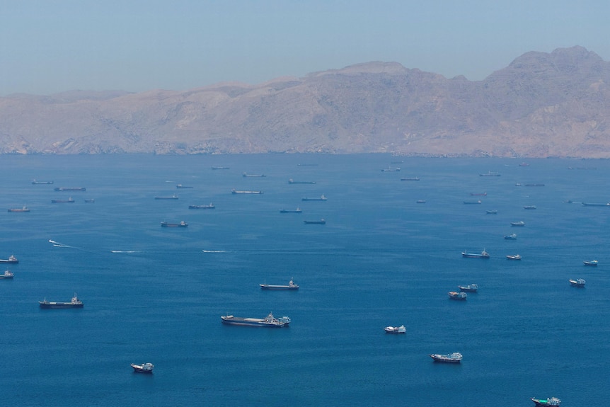 A drone view shows vessels sailing through the Strait of Hormuz.