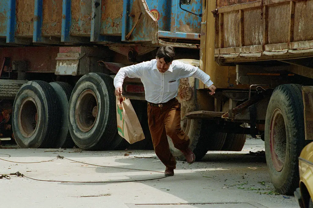 A Bosnian man rushed across a Sarajevo street infamous for sniper fire in 1992 (David Turnley/Corbis/VCG via Getty Images)
