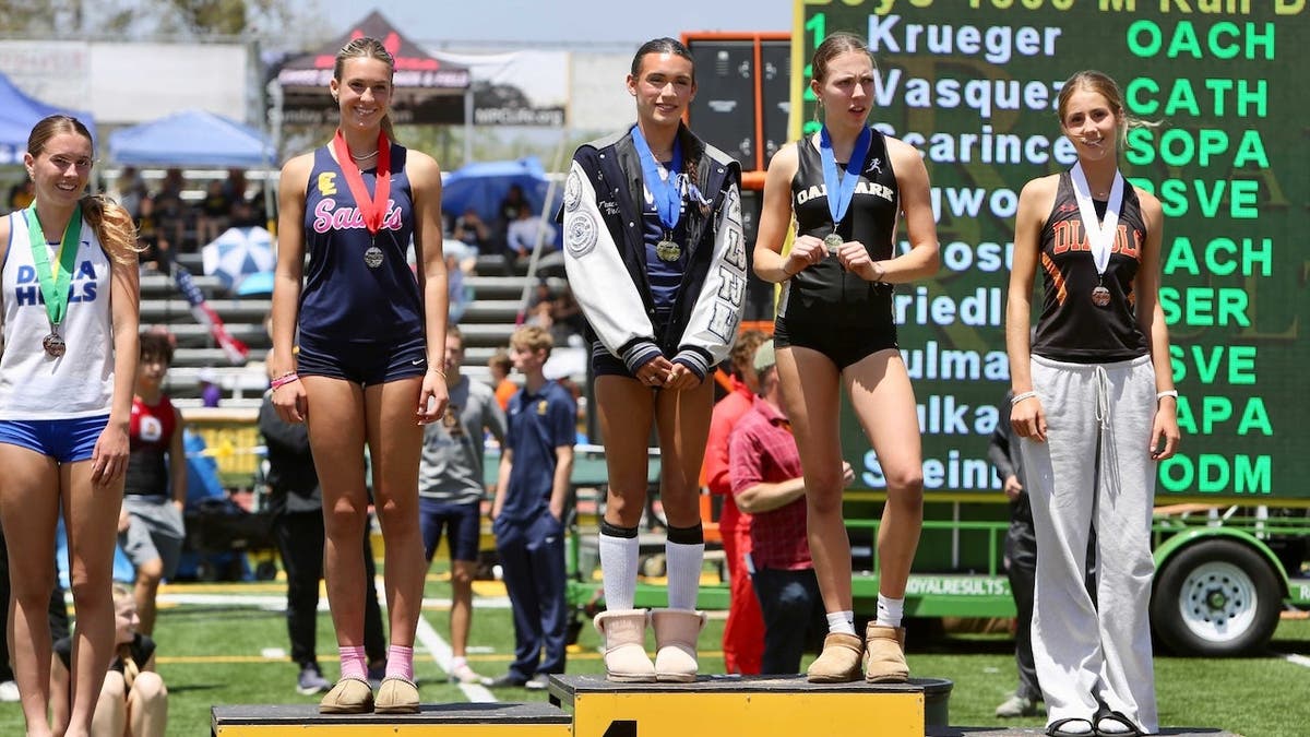 Trans athlete AB Hernandez shares first place on a podium with a female athlete at the CIF Southern Section final in Moorpark, California on May 16, 2026.