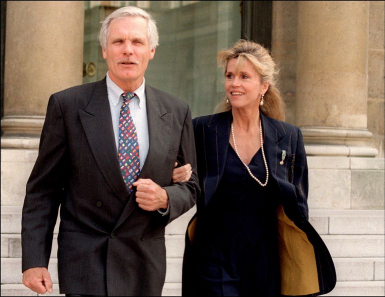 (FILES) Media mogul Ted Turner and his wife, actress Jane Fonda, leave the Elysee Palace on May 18, 1994 in Paris after visiting the French President François Mitterrand.