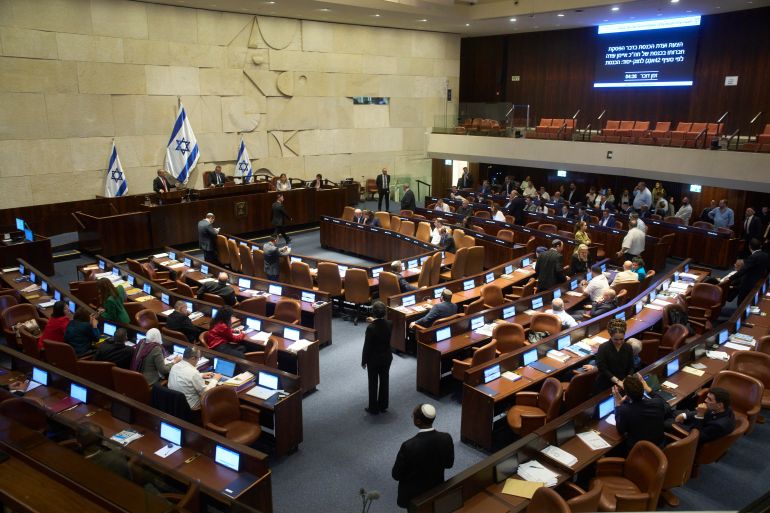 Lawmakers attend a session of the Knesset, Israel's parliament, in Jerusalem, Monday, July 14, 2025. (AP Photo/Ohad Zwigenberg)
