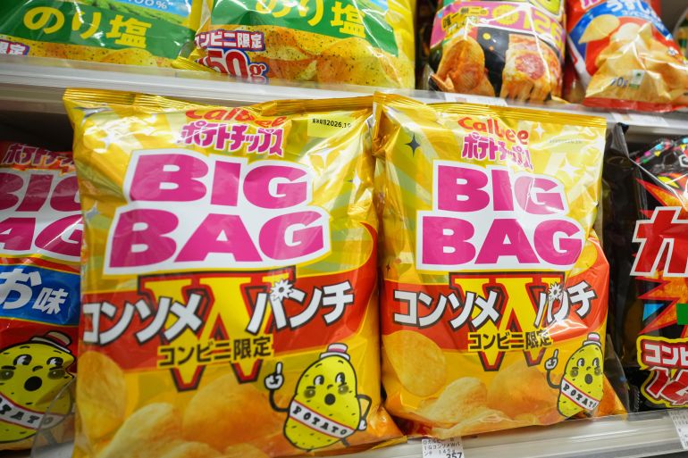 Potato chips packages of Calbee Inc., are seen at a convenience store in Tokyo, Wednesday, May 13, 2026. (AP Photo/Eugene Hoshiko)