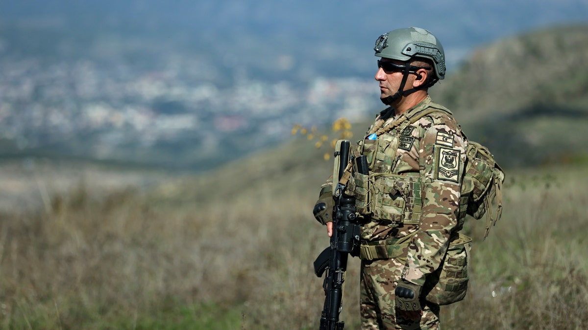 Azerbaijani serviceman patrolling near Khankendi