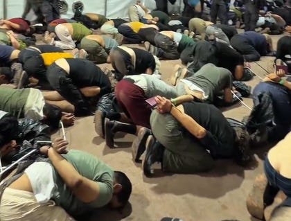 Gaza-bound flotilla activists crouch on the floor with their hands tied in zip-bands, on Wednesday. Credit: Screenshot/Itamar Ben-Gvir on X Gaza-bound flotilla activists crouch on the floor with their hands tied in zip-bands, on Wednesday.
