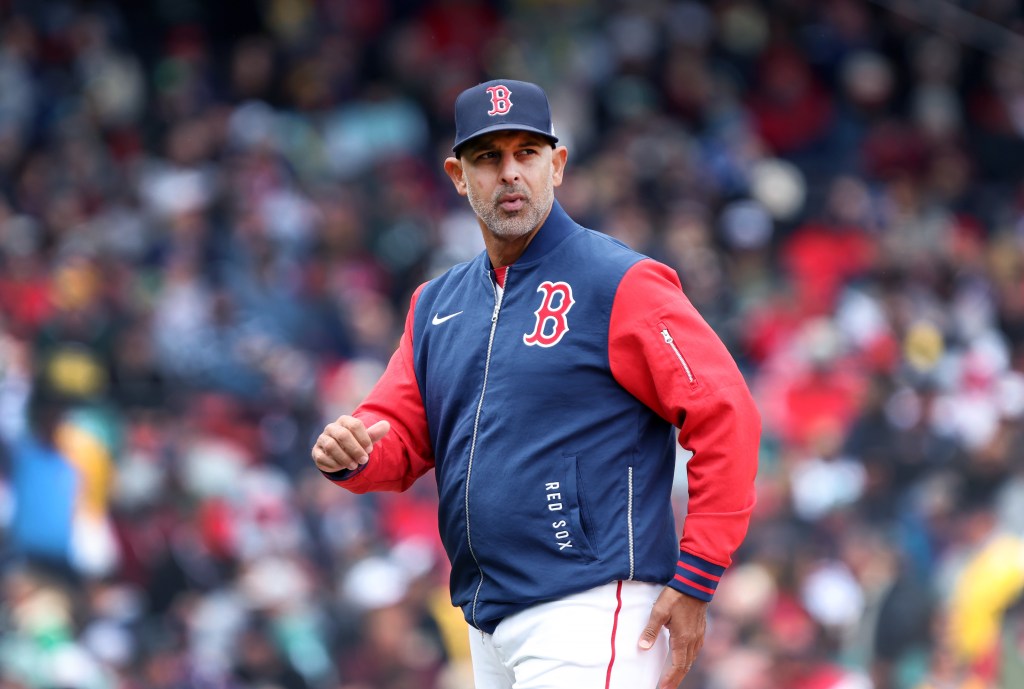 Boston Red Sox manager Alex Cora walking back to the dugout.