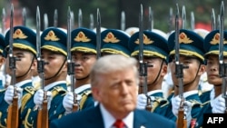 US President Donald Trump inspects a guard of honour during a welcome ceremony at the Great Hall of the People in Beijing on May 14.