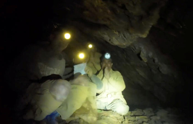 Rescuers support the first person recovered from the flooded cave on Friday night in Xaysomboun province in Laos. (Photo: Metta Tham Rescue Kalasin Facebook)