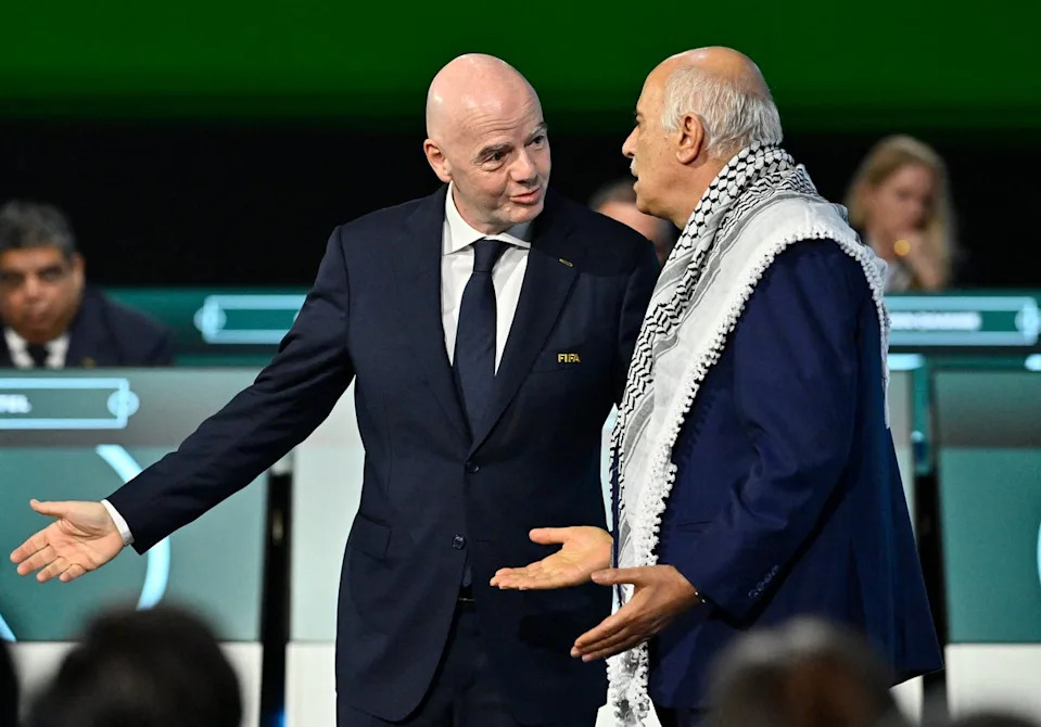 Infantino tired to convince Palestine FA chief Jibril Rajoub to shake hands with his Israeli counterpart (Reuters)