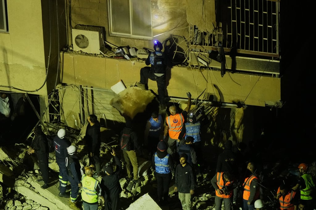 Rescuers search through the rubble of a damaged building for survivors following an Israeli air strike in Beirut’s southern suburbs on Wednesday. Photo: AP