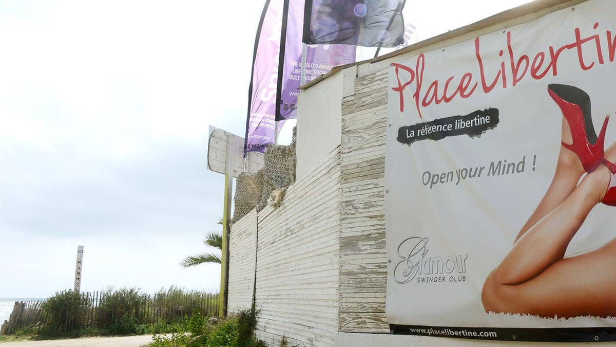 Advertising sign promoting permissive sex in the nudist village Cap d Agde in France