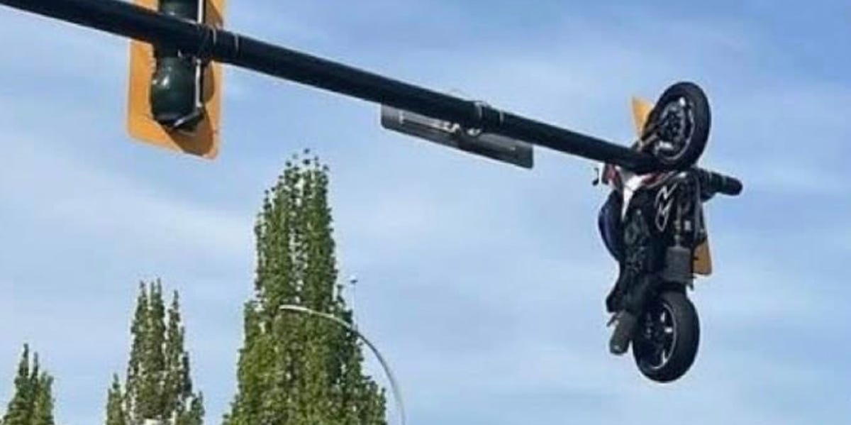 Motorcycle Left Hanging from Traffic Light After Dramatic BMW 3-Series Crash