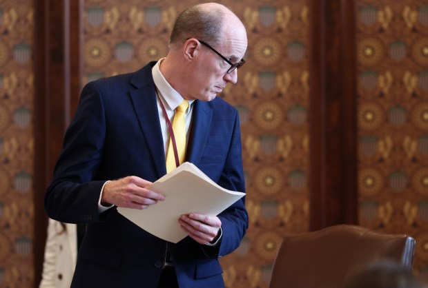 State Sen. Bill Cunningham works at his Senate chamber desk during the spring legislative session at the State Capitol, May 30, 2026, in Springfield. (John J. Kim/Chicago Tribune)