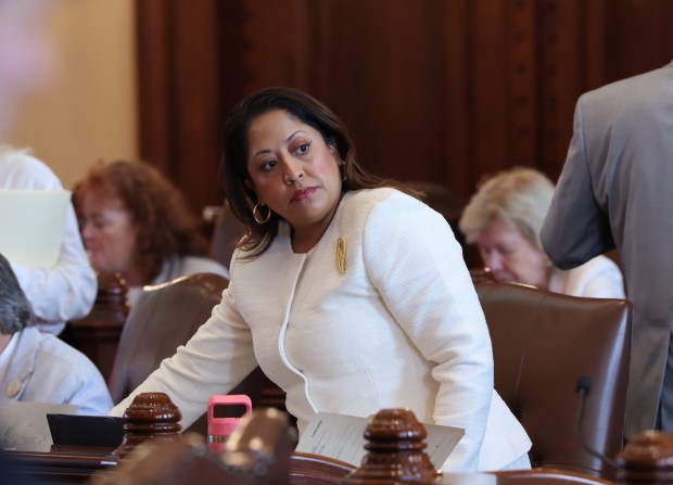 State Sen. Celina Villanueva works at her Senate chamber desk during the spring legislative session at the State Capitol, May 30, 2026, in Springfield. (John J. Kim/Chicago Tribune)