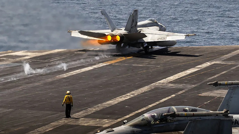 US Navy - PHOTO: A U.S. Navy fighter jet launches from aircraft carrier USS Abraham Lincoln in the Arabian Sea.