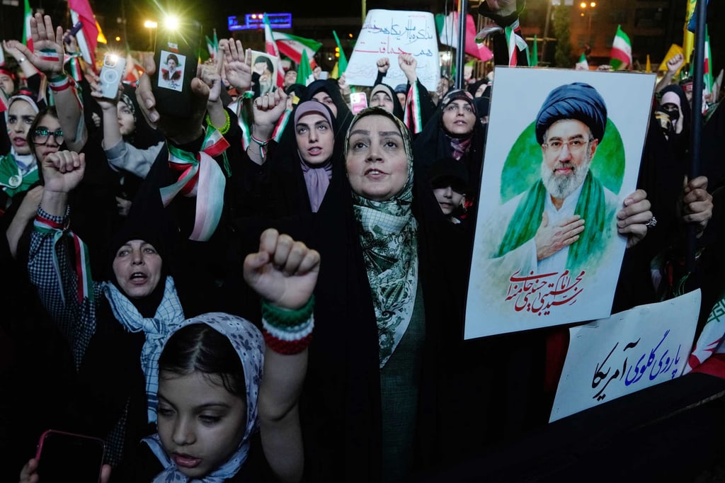 Pro-government demonstrators chant slogans as one of them holds a poster of Iranian Supreme Leader Ayatollah Mojtaba Khamenei in Tehran on May 4. Photo: AP