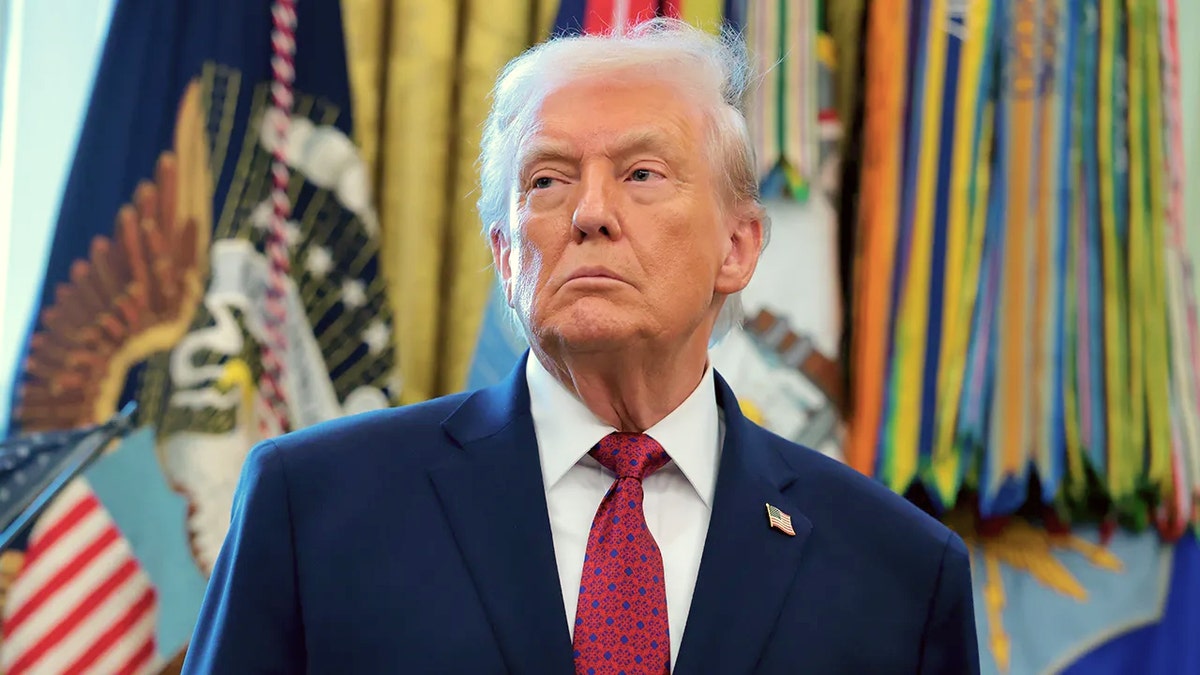 President Donald Trump seated in the Oval Office