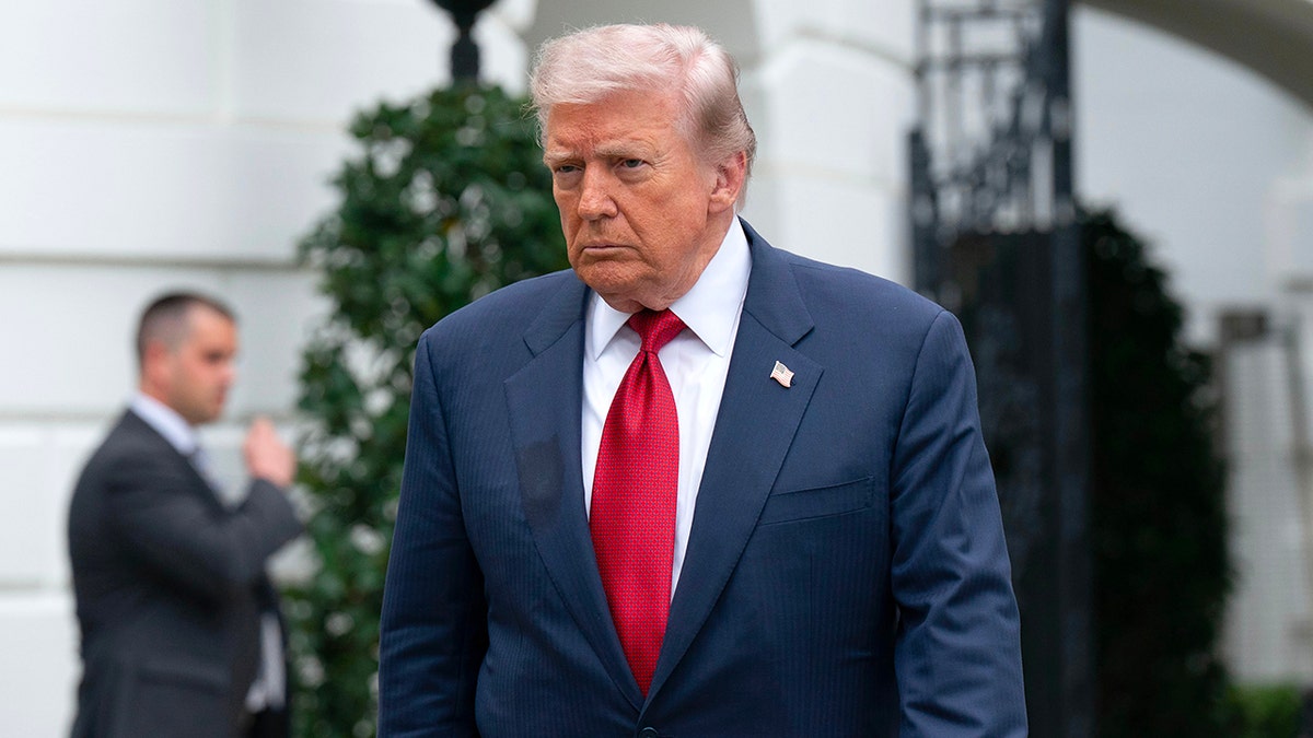 President Donald Trump walking on the South Lawn of the White House