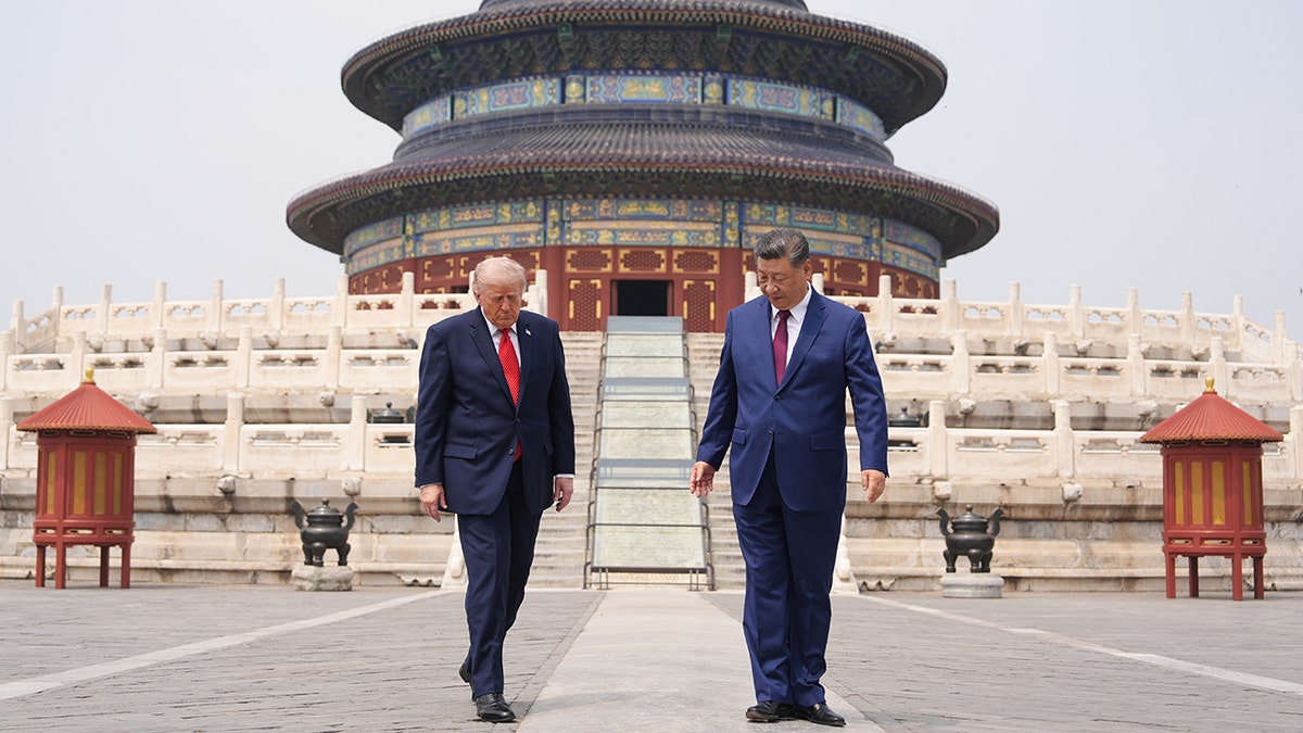 President Donald Trump walking with Chinese President Xi Jinping at the Temple of Heaven in Beijing