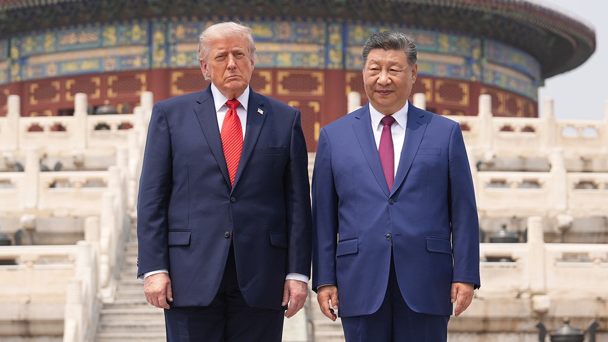 President Donald Trump standing with Chinese President Xi Jinping at the Temple of Heaven in Beijing