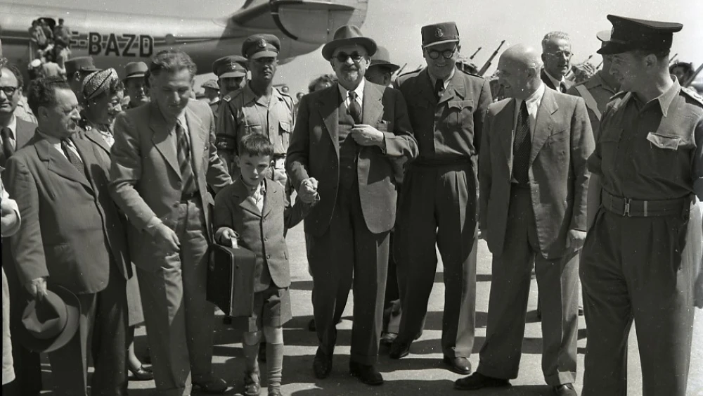 Israeli President Chaim Weitzmann (center) at Ben-Gurion International Airport, May 16, 1949.