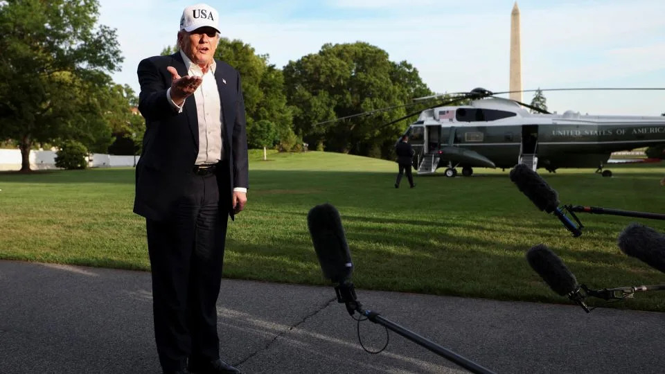 President Donald Trump speaks with members of the media as he returns to the White House after his trip to China, in Washington, DC, on Friday. - Kevin Lamarque/Reuters