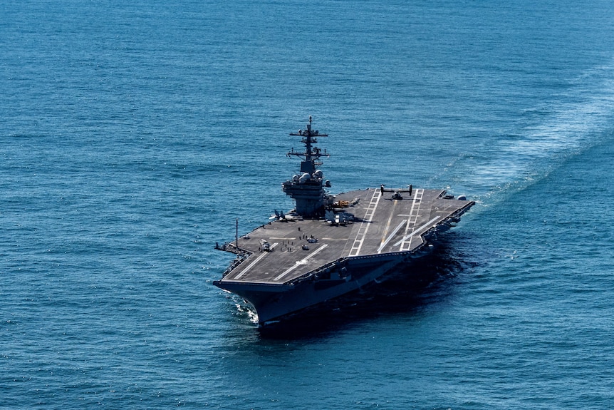 an aircraft carrier on the ocean