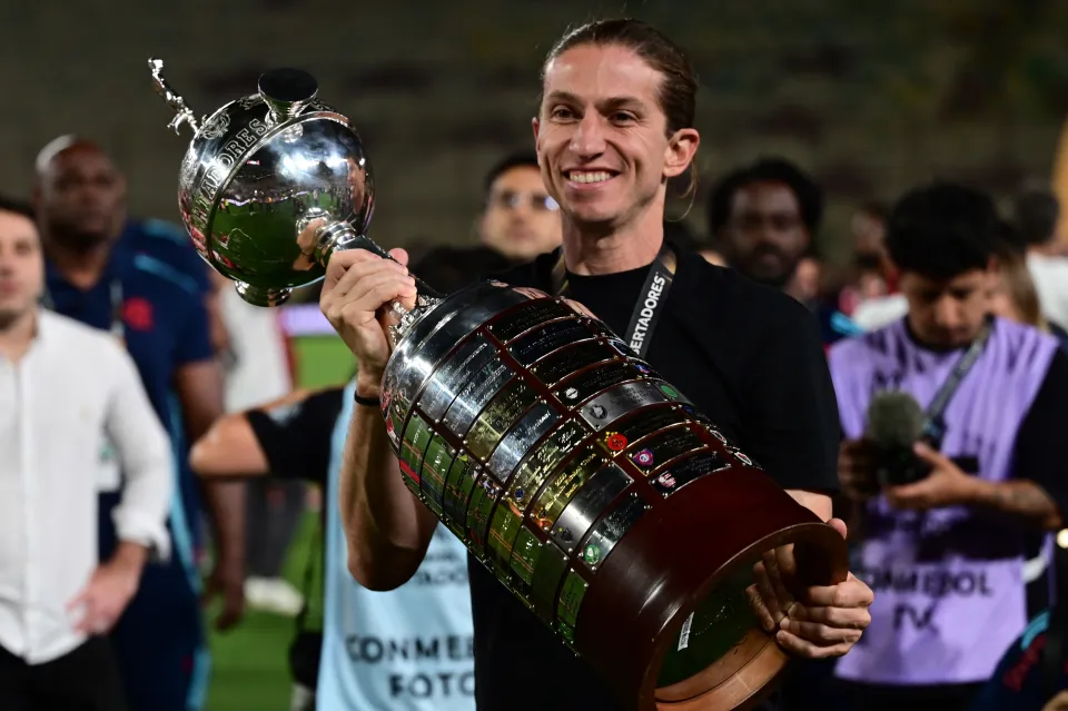 Filipe Luis celebrates with trophy