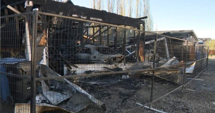 Several garages destroyed, homes damaged by overnight fire in southwest Calgary