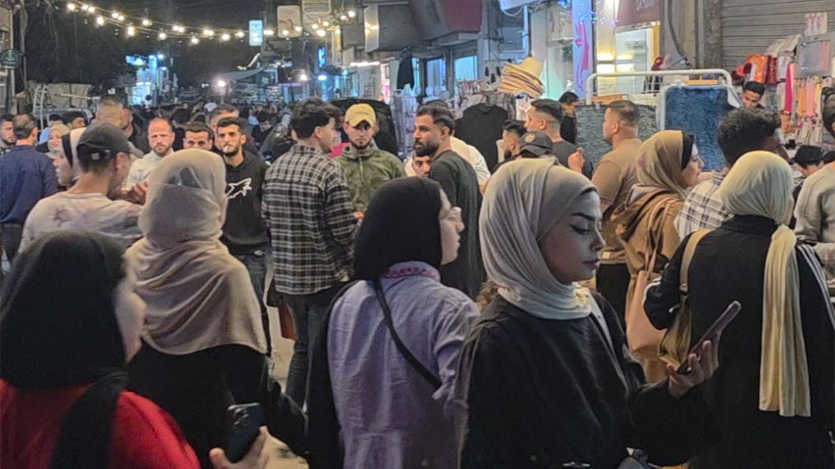 Palestinians shop at a market in Gaza