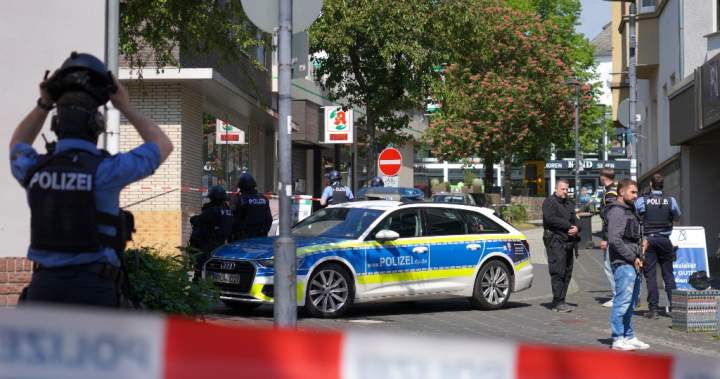 Suspect at large after hostage situation at bank in Germany, police say - National