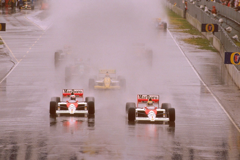 Ayrton Senna leads teammate Alain Prost at the start of the 1989 Australian Grand Prix. Neither would see the finish: Prost withdrew, while Senna smashed into the rear of Martin Brundle's Brabham on lap 13, unsighted by spray. Yes, that is Pierluigi Martini in a Minardi in P3...