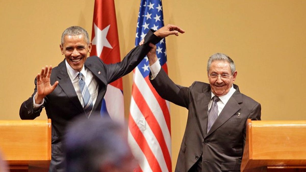 President Barack Obama and Raul Castro standing together in Cuba