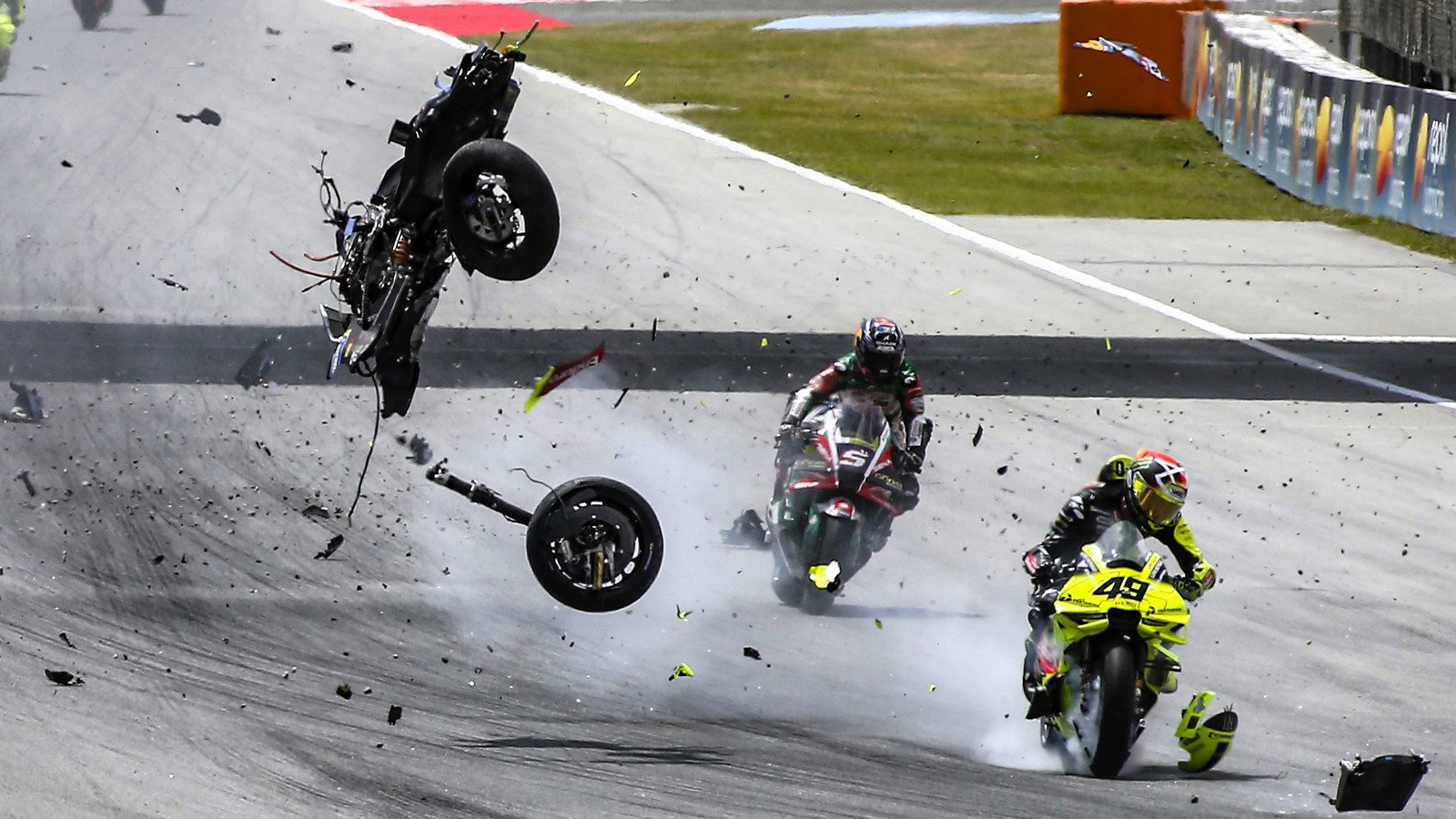 Fabio di Giannantonio hit by debris from Alex Marquez's bike, 2026 Catalan MotoGP.