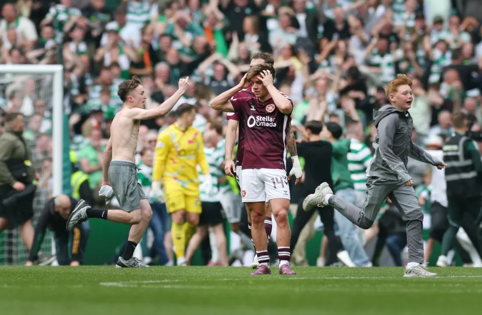 Cameron Devlin of Heart of Midlothian reacts after conceding a third goal scored by Callum Osmand of Celtic (not pictured) during the William Hill Premiership match between Celtic and Heart of Midlothian