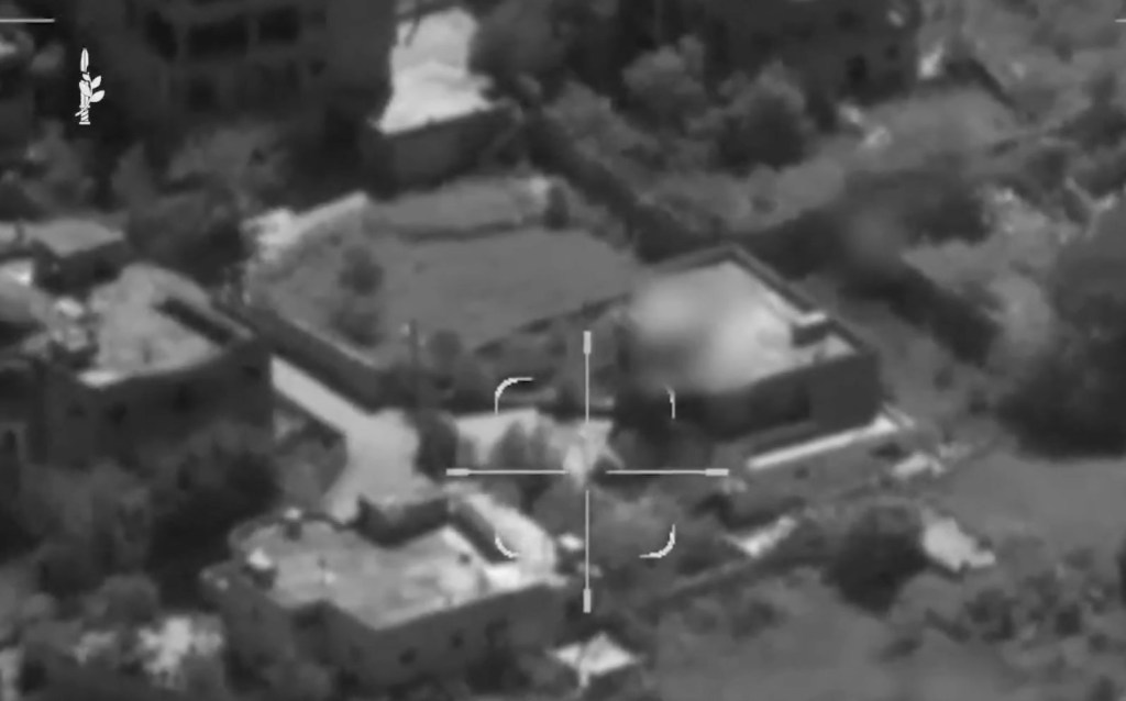 Aerial view with target crosshairs on buildings, including one with a dome.