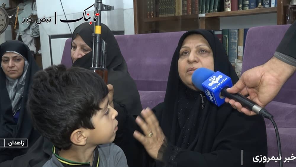 IRIB state television broadcast from Zahedan, May 16, 2026, showing regime-affiliated woman interviewed with an assault rifle