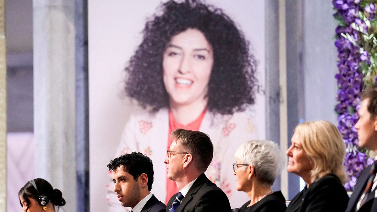 Ali and Kiana Rahmani accepting Nobel Peace Prize on behalf of Narges Mohammadi at Oslo City Hall