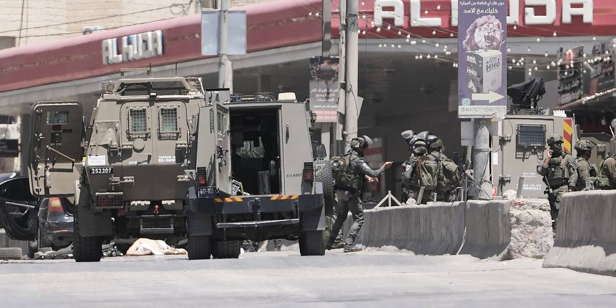 Israel's military said a Palestinian family could bury their father. Then the settlers arrived