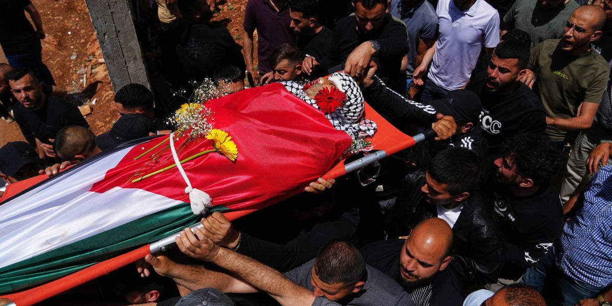 Palestinian man shot dead while climbing West Bank barrier into Israel in search of work