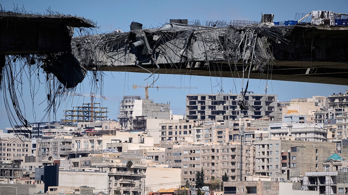 A damaged bridge in Karaj, Iran, after airstrikes west of Tehran