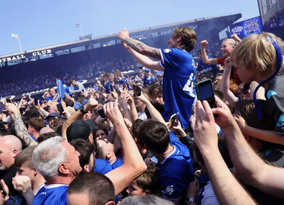 Jack Clarke of Ipswich Town celebrates with fans on the pitch after the team secured promotion ot the Premier League during the Sky Bet Championship match between Ipswich Town and Queens Park Rangers