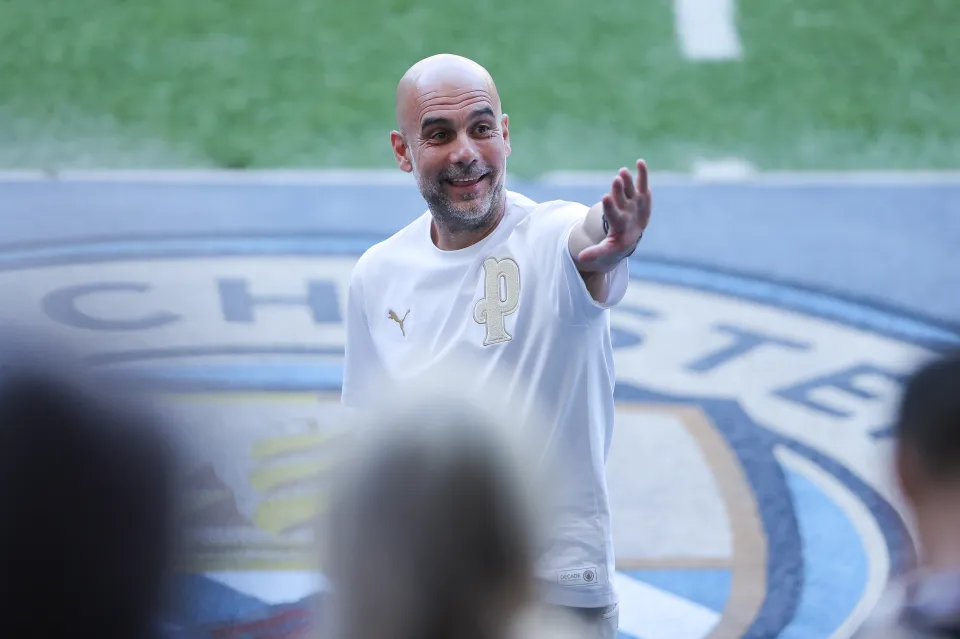 Josep 'Pep' Guardiola, head coach of Manchester City, waves goodbye to the Manchester City supporters after the Premier League match between Manchester City and Aston Villa