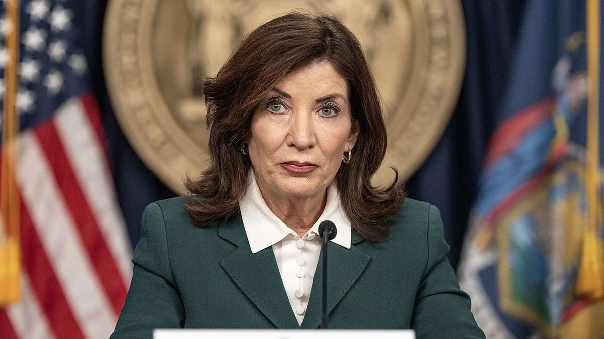 New York Gov. Kathy Hochul speaking at a press conference indoors