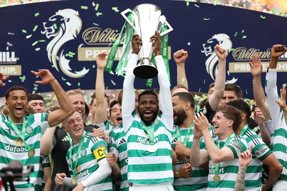 Kelechi Iheanacho of Celtic lifts the William Hill Premiership Trophy with teammates following the team's victory in the William Hill Premiership match between Celtic and Heart of Midlothian