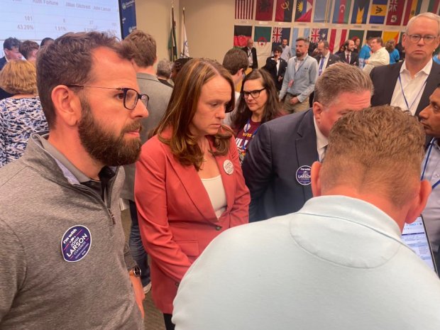 State Rep. Jillian Gilchrest of West Hartford watches as votes are counted at the convention on May 11 in East Hartford. She is standing with U.S. Rep. John Larson's campaign manager, Greg Gerratana. Gilchrest later qualified for the primary by reaching the minimum of 15% of the delegates. (Christopher Keating/Hartford Courant)