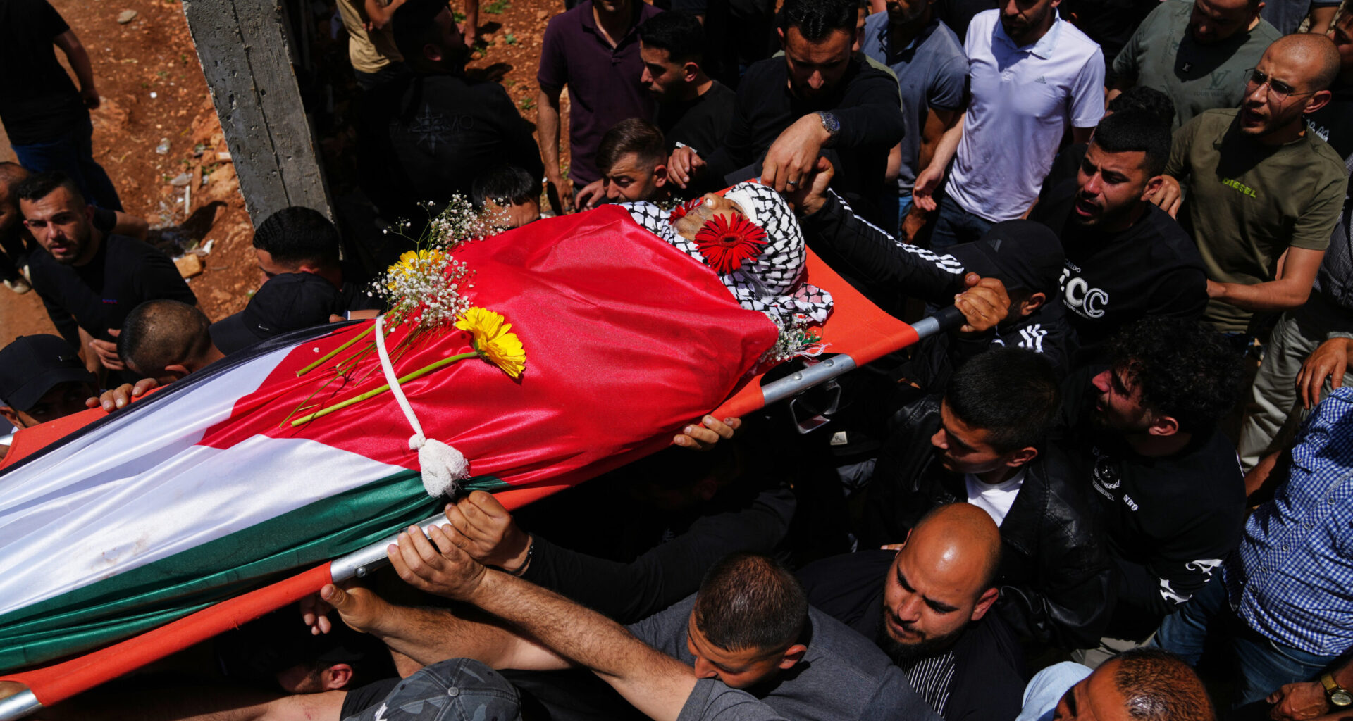 Palestinian man shot dead while climbing West Bank barrier into Israel in search of work